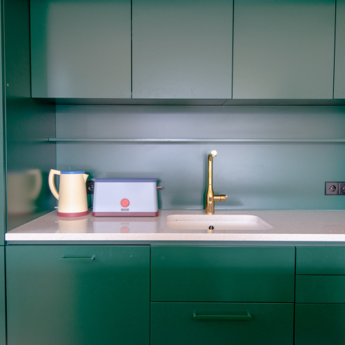 A Townhouse with Petrol-Green Accents